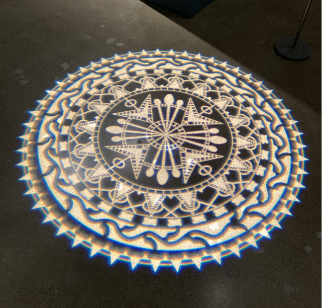 Example of lace-motif light projection on the floor in Making Her Mark exhibition at AGO.