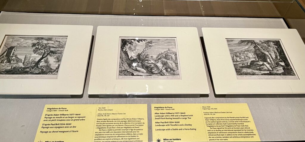 An installation view of three black-and-white engravings of landscape scenes by Magdalena de Passe in ivory-colored square matte frames.