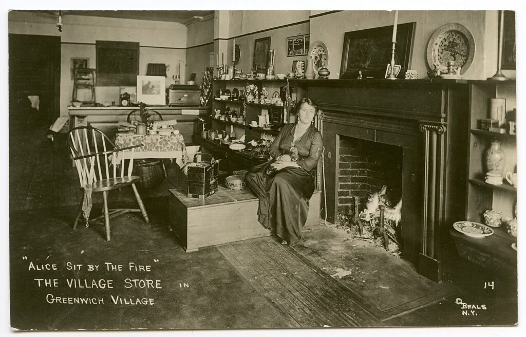 Shop manager Alice Palmer sits comfortably next to the fireplace, surrounded by shelves holding items from her small but cozy one-room store. The items for sale include fine china, teacups, bowls, decorative plates, and candlesticks. An empty chair next to the chest where Ms. Palmer rests makes it clear that this is more than a store. It is a place where customers can stay awhile – relax, chat, and perhaps have tea as well.